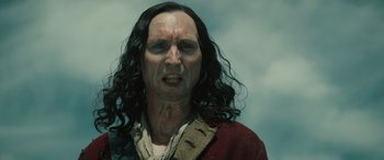 Movie still from “Pet Sematary: Bloodlines” (2023), directed by Lindsey Anderson Beer – A person with long black hair; Close Up shot, Low angle