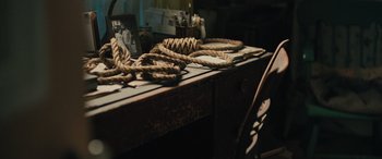 Movie still from “Pet Sematary: Bloodlines” (2023), directed by Lindsey Anderson Beer – A wooden desk with rope on top of it; Extreme Close Up shot, High angle