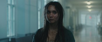 Movie still from “Pet Sematary: Bloodlines” (2023), directed by Lindsey Anderson Beer – A young woman with long black hair is looking at the camera; Close Up shot, Low angle