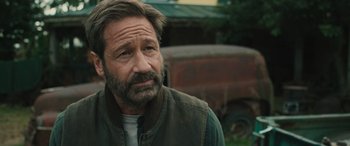 Movie still from “Pet Sematary: Bloodlines” (2023), directed by Lindsey Anderson Beer – A person with a beard; Close Up shot, Over the shoulder angle