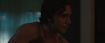 Movie still from “Pet Sematary: Bloodlines” (2023), directed by Lindsey Anderson Beer – A person wearing a necklace; Close Up shot, Over the shoulder angle