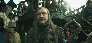 Movie still from “Peter Pan & Wendy” (2023), directed by David Lowery – A person with long hair; Medium shot, Low angle