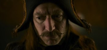 Movie still from “Peter Pan & Wendy” (2023), directed by David Lowery – A person wearing a hat; Close Up shot, Low angle