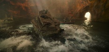 Movie still from “Peter Pan & Wendy” (2023), directed by David Lowery – A group of people on a boat in a body of water; Extreme Wide shot, High angle