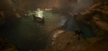 Movie still from “Peter Pan & Wendy” (2023), directed by David Lowery – A small boat floating in the middle of a lake; Extreme Wide shot, High angle