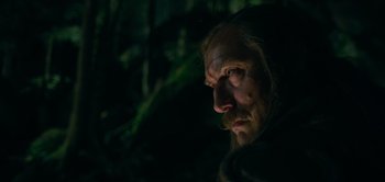 Movie still from “Peter Pan & Wendy” (2023), directed by David Lowery – A man with long hair and a beard is looking into the distance; Close Up shot, Low angle