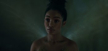 Movie still from “Peter Pan & Wendy” (2023), directed by David Lowery – A young woman with dark hair is looking at the camera; Close Up shot, High angle