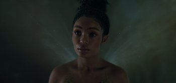 Movie still from “Peter Pan & Wendy” (2023), directed by David Lowery – A young woman with dark hair is looking at the camera; Close Up shot, Overhead angle