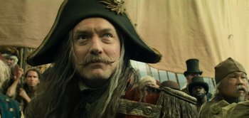 Movie still from “Peter Pan & Wendy” (2023), directed by David Lowery – A person wearing a pirate hat; Close Up shot, Low angle