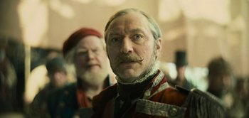 Movie still from “Peter Pan & Wendy” (2023), directed by David Lowery – A man with a long mustache and a beard; Close Up shot, Low angle