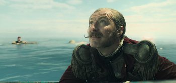 Movie still from “Peter Pan & Wendy” (2023), directed by David Lowery – A person with a beard and a mustache; Close Up shot, Low angle