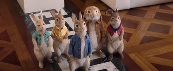 Movie still from “Peter Rabbit 2: The Runaway” (2021), directed by Will Gluck – A group of rabbits dressed up in clothes; Wide shot, High angle