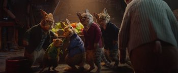Movie still from “Peter Rabbit 2: The Runaway” (2021), directed by Will Gluck – A group of stuffed animals standing next to each other in a room; Medium shot, High angle