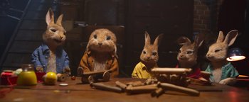 Movie still from “Peter Rabbit 2: The Runaway” (2021), directed by Will Gluck – A couple of stuffed animals sitting on top of a wooden table; Close Up shot, High angle