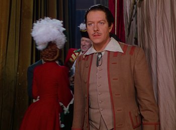 Movie still from “Phantom of the Opera” (1943), directed by Arthur Lubin – A man and a woman dressed in period clothing; Medium shot, High angle