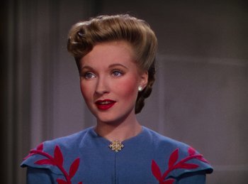 Movie still from “Phantom of the Opera” (1943), directed by Arthur Lubin – A person wearing a blue dress; Close Up shot, Over the shoulder angle