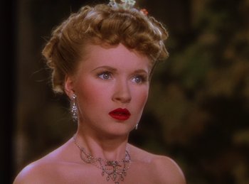 Movie still from “Phantom of the Opera” (1943), directed by Arthur Lubin – A woman with a red lipstick and a necklace; Close Up shot, High angle
