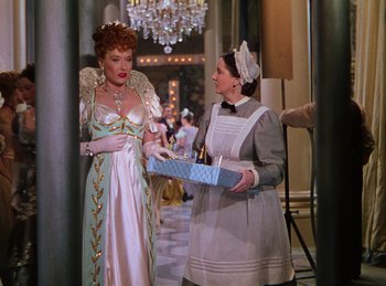 Movie still from “Phantom of the Opera” (1943), directed by Arthur Lubin – Two women dressed in old fashion clothing in a room; Medium shot, Low angle