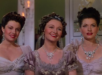 Movie still from “Phantom of the Opera” (1943), directed by Arthur Lubin – A group of three women with long hair; Medium shot, Low angle