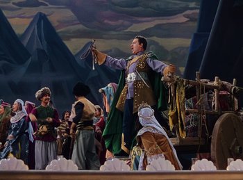 Movie still from “Phantom of the Opera” (1943), directed by Arthur Lubin – A group of people standing around a stage; Wide shot, Low angle