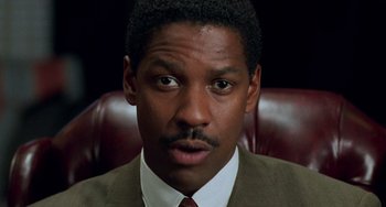 Movie still from “Philadelphia” (1993), directed by Jonathan Demme – A person wearing a suit and tie; Close Up shot, High angle