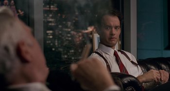 Movie still from “Philadelphia” (1993), directed by Jonathan Demme – A man in a suit and tie looking at himself in the mirror; Close Up shot, Over the shoulder angle