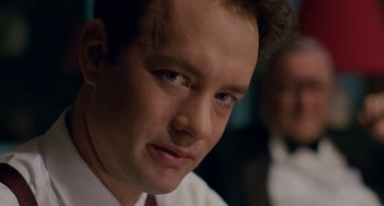 Movie still from “Philadelphia” (1993), directed by Jonathan Demme – A person wearing a suit and tie; Close Up shot, Over the shoulder angle