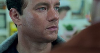 Movie still from “Philadelphia” (1993), directed by Jonathan Demme – A man's face with green eyes; Close Up shot, Over the shoulder angle
