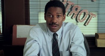 Movie still from “Philadelphia” (1993), directed by Jonathan Demme – A person wearing a shirt and a tie; Close Up shot, Low angle