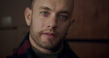 Movie still from “Philadelphia” (1993), directed by Jonathan Demme – A person wearing a sweater; Close Up shot, Low angle