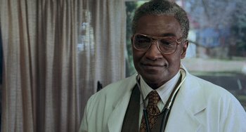 Movie still from “Philadelphia” (1993), directed by Jonathan Demme – An older man wearing a white shirt and a tie; Close Up shot, Low angle