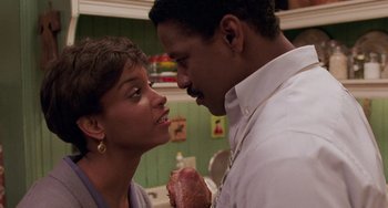 Movie still from “Philadelphia” (1993), directed by Jonathan Demme – A man and a woman looking at each other; Close Up shot, Over the shoulder angle