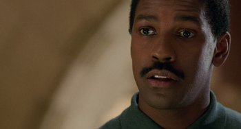 Movie still from “Philadelphia” (1993), directed by Jonathan Demme – A person with a mustache; Close Up shot, Low angle