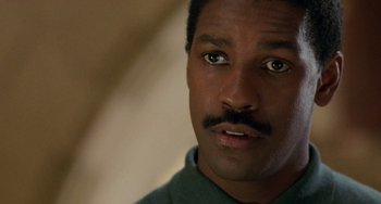 Movie still from “Philadelphia” (1993), directed by Jonathan Demme – A person with a mustache; Close Up shot, Over the shoulder angle