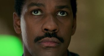 Movie still from “Philadelphia” (1993), directed by Jonathan Demme – A person's face with green eyes; Close Up shot, Low angle