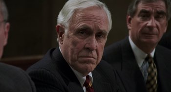 Movie still from “Philadelphia” (1993), directed by Jonathan Demme – An older man wearing a suit and tie; Close Up shot, Over the shoulder angle