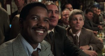 Movie still from “Philadelphia” (1993), directed by Jonathan Demme – A group of men and women sitting in front of a camera; Close Up shot, Low angle