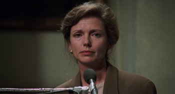 Movie still from “Philadelphia” (1993), directed by Jonathan Demme – A person speaking on a microphone; Close Up shot, Low angle