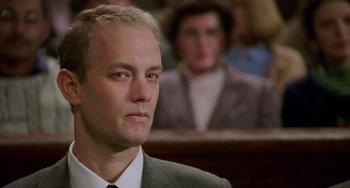 Movie still from “Philadelphia” (1993), directed by Jonathan Demme – A person wearing a suit and tie; Close Up shot, Low angle