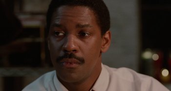 Movie still from “Philadelphia” (1993), directed by Jonathan Demme – A person wearing a white shirt; Close Up shot, Over the shoulder angle