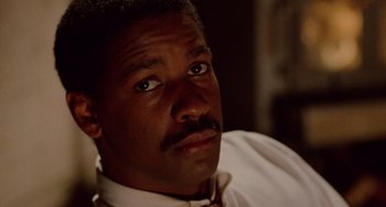 Movie still from “Philadelphia” (1993), directed by Jonathan Demme – A person wearing a shirt and tie; Close Up shot, Low angle