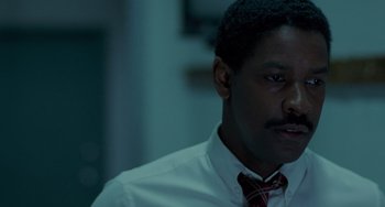 Movie still from “Philadelphia” (1993), directed by Jonathan Demme – A person wearing a shirt and a tie; Close Up shot, Over the shoulder angle