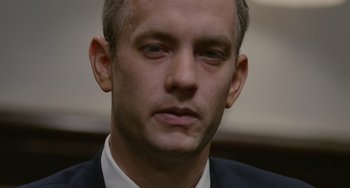 Movie still from “Philadelphia” (1993), directed by Jonathan Demme – A person wearing a suit and tie; Close Up shot, Low angle