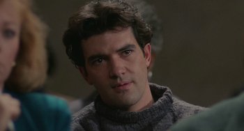 Movie still from “Philadelphia” (1993), directed by Jonathan Demme – A person wearing a sweater; Close Up shot, Over the shoulder angle