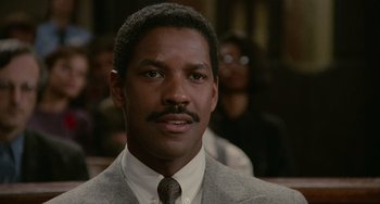 Movie still from “Philadelphia” (1993), directed by Jonathan Demme – A person wearing a suit and a tie; Close Up shot, Low angle