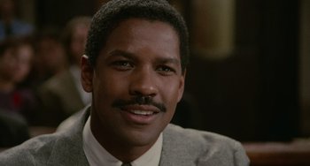 Movie still from “Philadelphia” (1993), directed by Jonathan Demme – A person wearing a suit and tie; Close Up shot, Over the shoulder angle