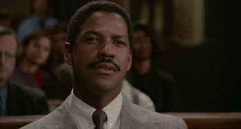 Movie still from “Philadelphia” (1993), directed by Jonathan Demme – A person wearing a suit and a tie; Close Up shot, Low angle