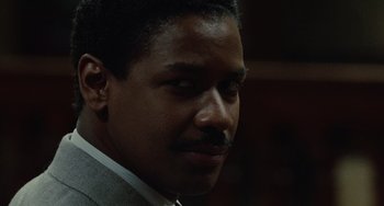 Movie still from “Philadelphia” (1993), directed by Jonathan Demme – A person wearing a suit and tie; Close Up shot, Low angle