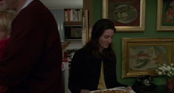 Movie still from “Philadelphia” (1993), directed by Jonathan Demme – A woman holding a tray of food in a kitchen; Medium shot, Over the shoulder angle