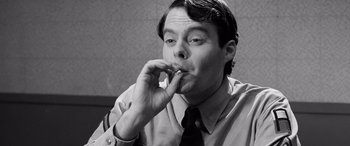 Movie still from “Pineapple Express” (2008), directed by David Gordon Green – Black and white photograph of a man smoking a cigarette; Close Up shot, Low angle